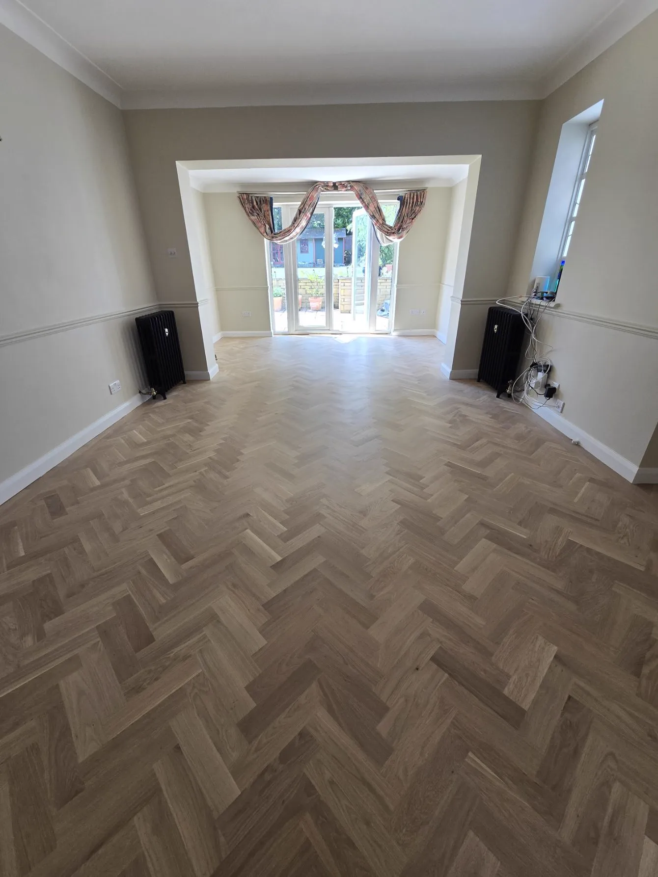 Oak herringbone parquet floor in a Purley CR8 living room, restored and refinished after flood damage